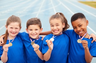 gallery/portrait-of-children-showing-off-winners-medals-mvhq8jx